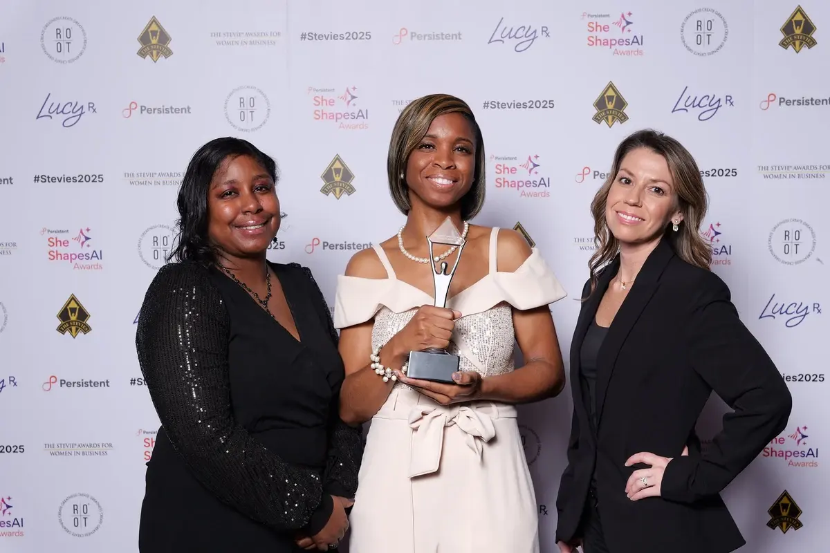 Alisha Simpson-Watt and team holding the 2025 Stevie Award at The Stevie Awards for Women in Business / She Shapes AI Awards ceremony