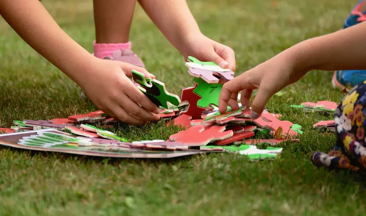 Children working together during a social skills and peer interaction activity